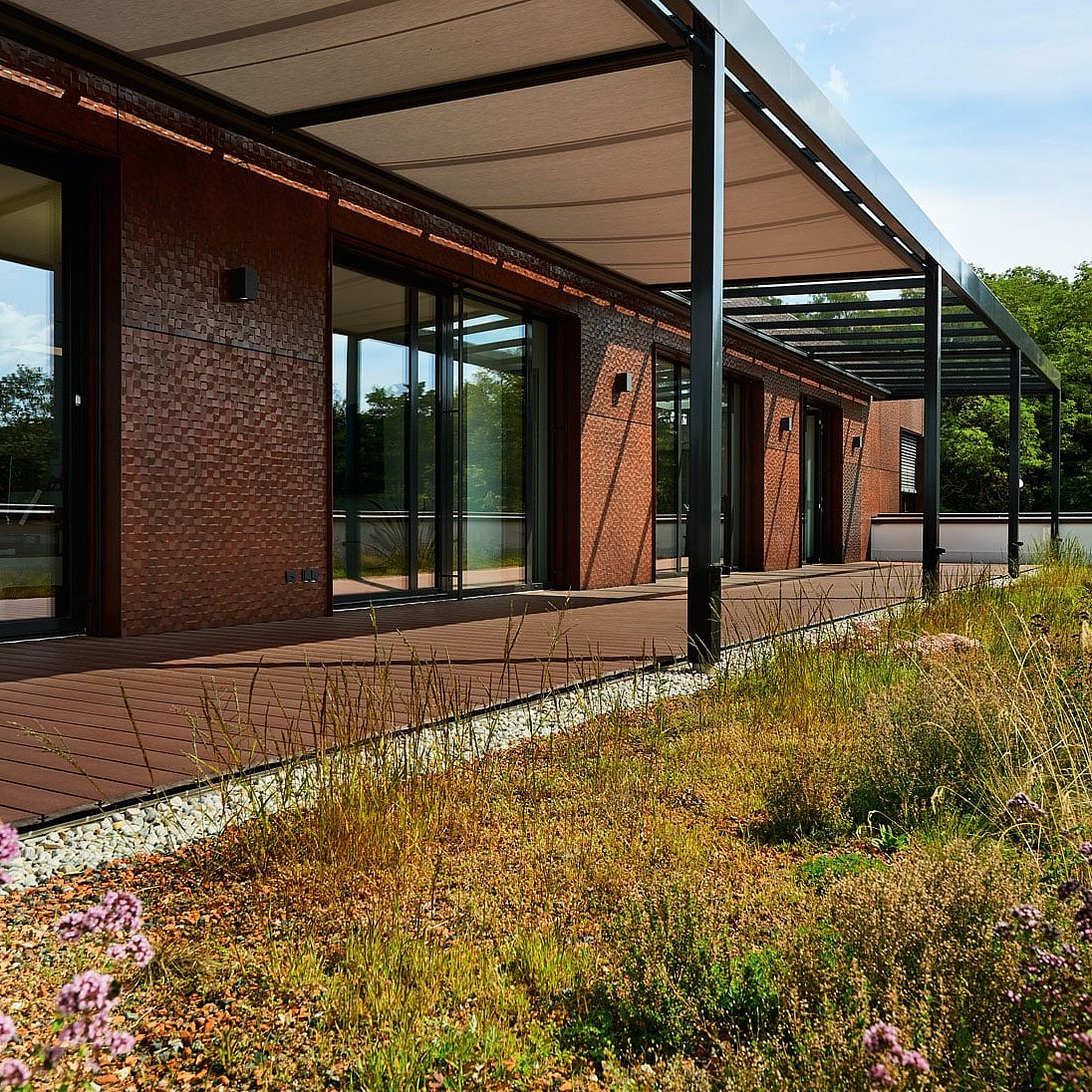 The smart one in brown from NaturinForm laid out in front of a residential building