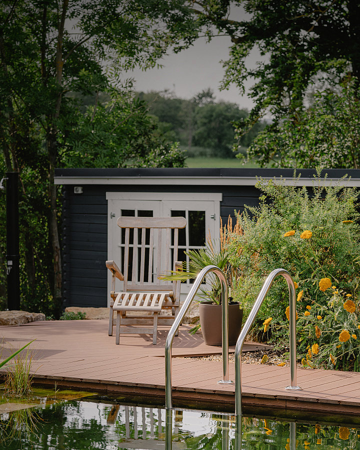 NaturinForm WPC terrace behind a pond pool